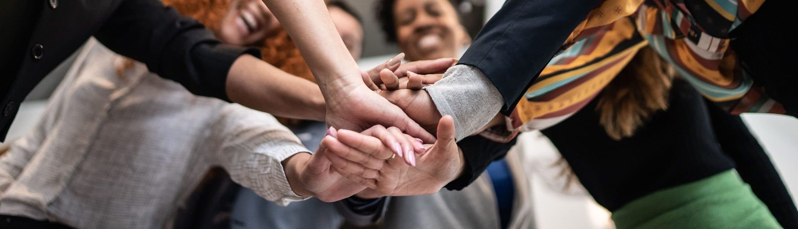 LifeSafe Services team joining hands together